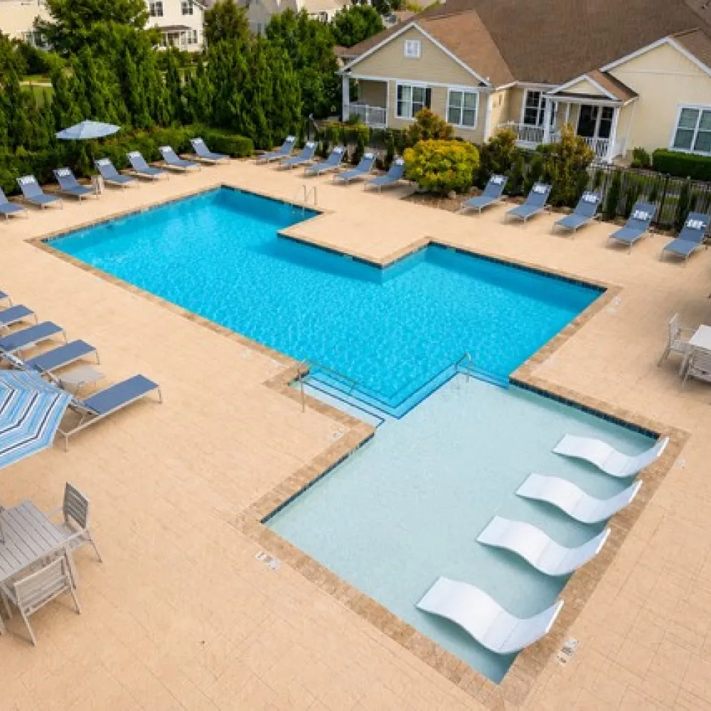 Saltwater swimming pool with in-water lounge chairs